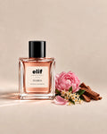 Elif Floria long-lasting perfume bottle with soft pink floral fragrance, peony, delicate white flowers, green leaves, and warm woody accents, presented in an elegant extrait de parfum bottle on a neutral background.