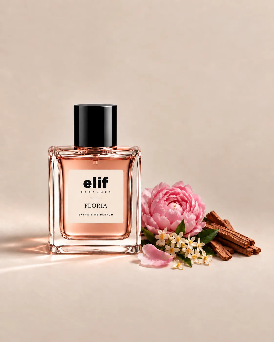 Elif Floria long-lasting perfume bottle with soft pink floral fragrance, peony, delicate white flowers, green leaves, and warm woody accents, presented in an elegant extrait de parfum bottle on a neutral background.