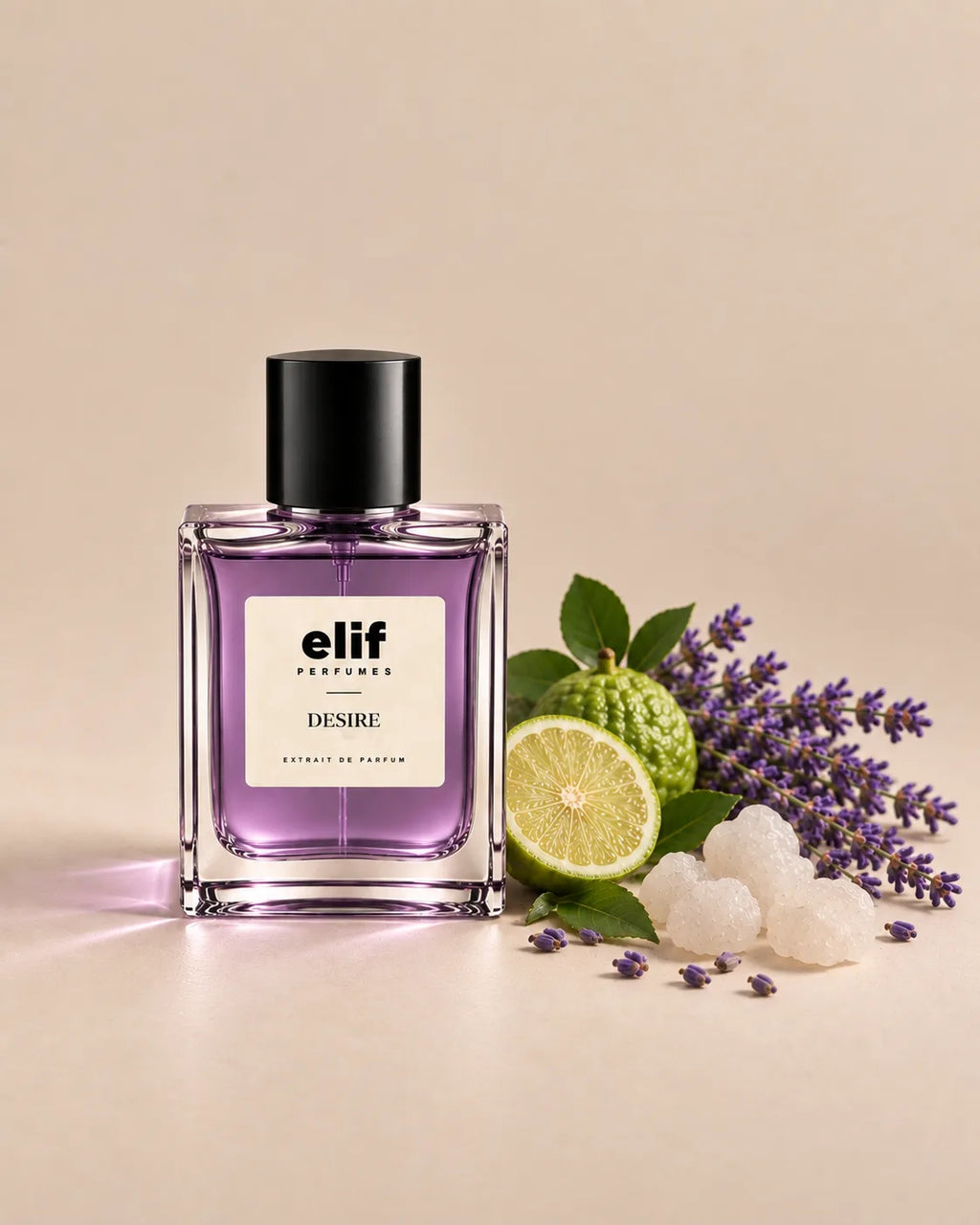 Elif Desire perfume bottle with a soft lavender-purple liquid and glossy black cap, displayed against a warm beige background. Fresh bergamot with green leaves, delicate lavender sprigs, and white crystalline sugar are arranged beside the bottle, with soft directional lighting and subtle shadows. A long-lasting fragrance with a fresh, citrusy, floral, and sweet character.